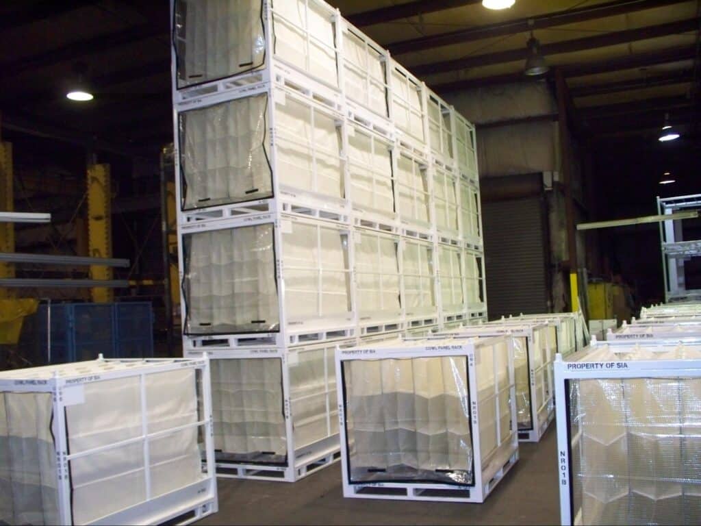 Stacked plastic containers in a warehouse showing efficient storage solutions for materials.